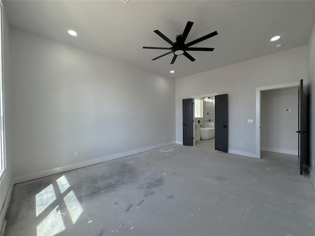 7120 NW 155th St, Edmond, OK 73013 - unfurnished bedroom with unfinished concrete floors, baseboards, recessed lighting, and ensuite bath
