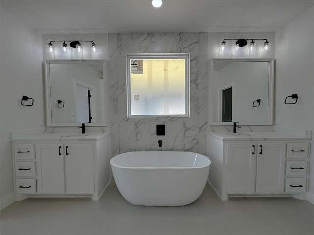 7120 NW 155th St, Edmond, OK 73013 - bathroom featuring a sink, two vanities, and a soaking tub