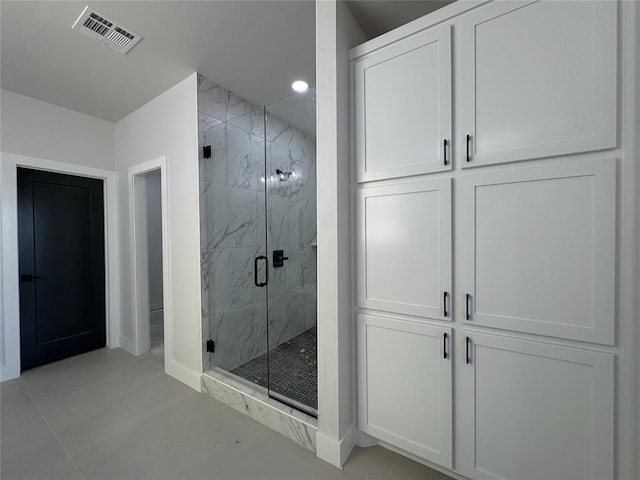 7120 NW 155th St, Edmond, OK 73013 - full bathroom with visible vents, baseboards, recessed lighting, tile patterned floors, and a marble finish shower