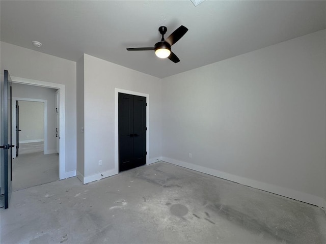 7120 NW 155th St, Edmond, OK 73013 - unfurnished bedroom featuring a closet, baseboards, a ceiling fan, and unfinished concrete flooring