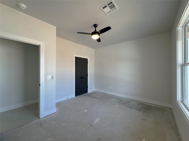 7120 NW 155th St, Edmond, OK 73013 - unfurnished bedroom with baseboards, ceiling fan, concrete flooring, and visible vents