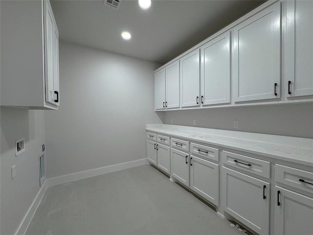 7120 NW 155th St, Edmond, OK 73013 - washroom with washer hookup, visible vents, cabinet space, baseboards, and recessed lighting