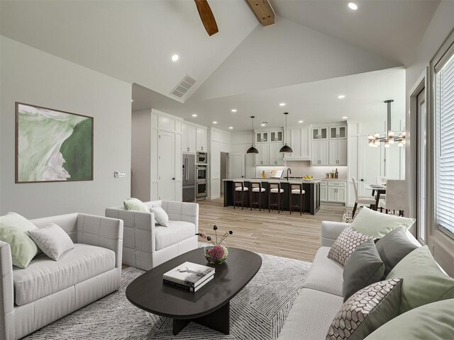 living room with visible vents, high vaulted ceiling, beamed ceiling, light wood-style floors, and recessed lighting