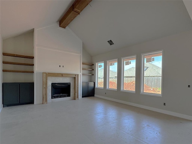 unfurnished living room with visible vents, beam ceiling, a fireplace, baseboards, and high vaulted ceiling