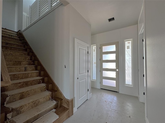 foyer featuring stairs