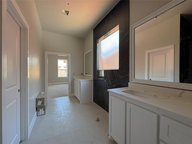 bathroom with baseboards and vanity