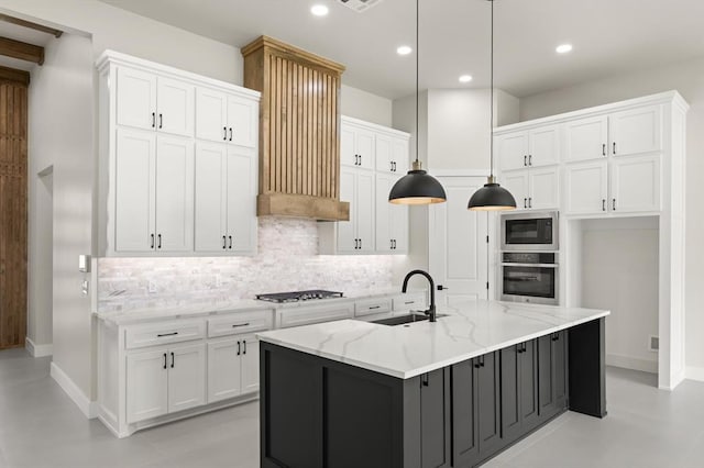 15600 Rockwell Park Ln, Edmond, OK 73013 - kitchen with stainless steel appliances, white cabinets, backsplash, decorative light fixtures, and recessed lighting