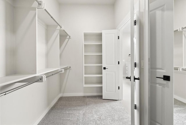 15600 Rockwell Park Ln, Edmond, OK 73013 - walk in closet with light carpet