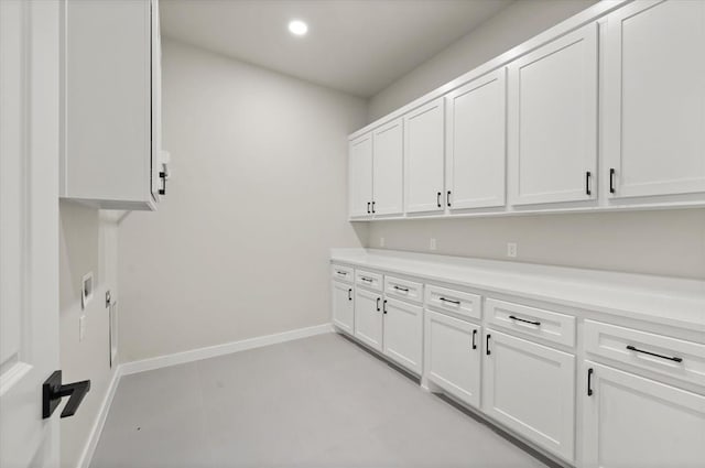 15600 Rockwell Park Ln, Edmond, OK 73013 - washroom featuring cabinet space and recessed lighting