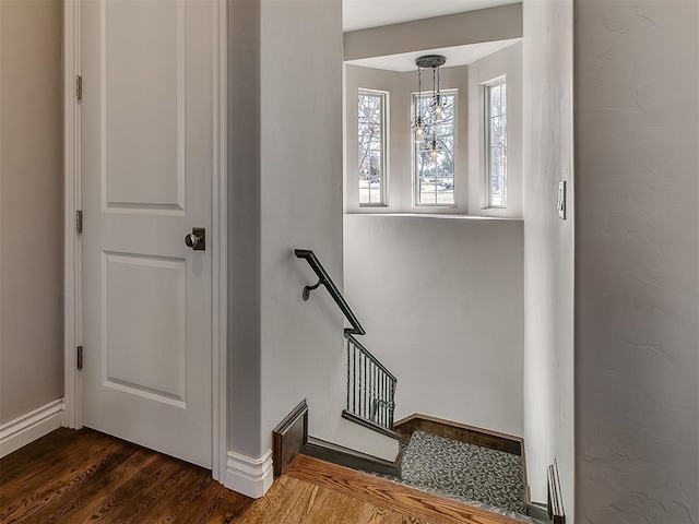 1109 Salvo Bridge Ct, Edmond, OK 73034 - stairway featuring wood finished floors and a chandelier