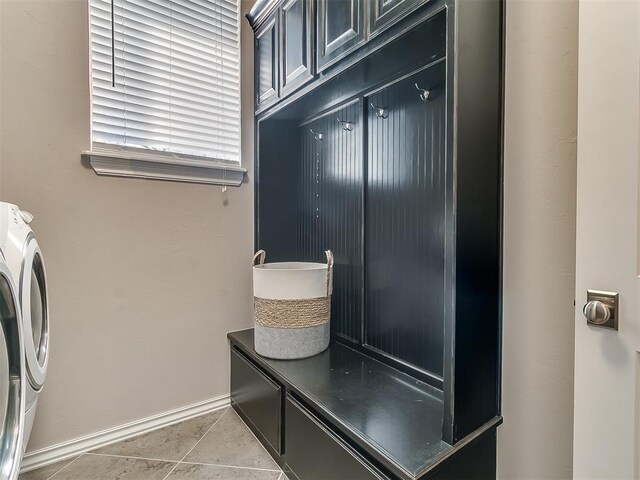 1109 Salvo Bridge Ct, Edmond, OK 73034 - laundry area with washer / clothes dryer and light tile patterned floors