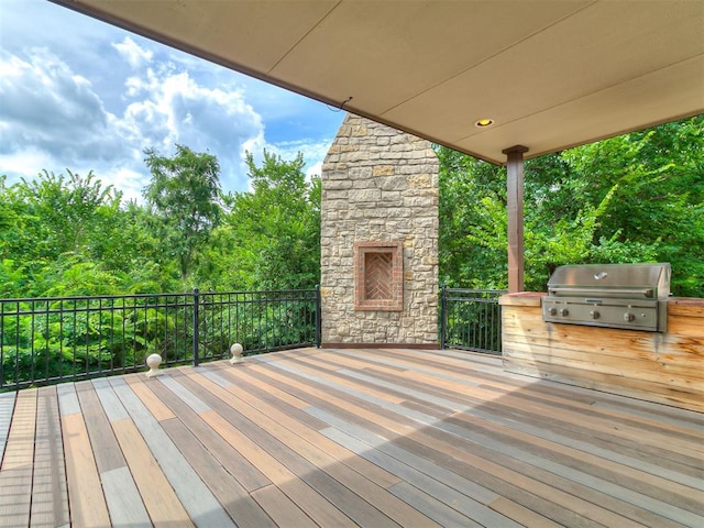 1109 Salvo Bridge Ct, Edmond, OK 73034 - wooden terrace featuring area for grilling and view of scattered trees