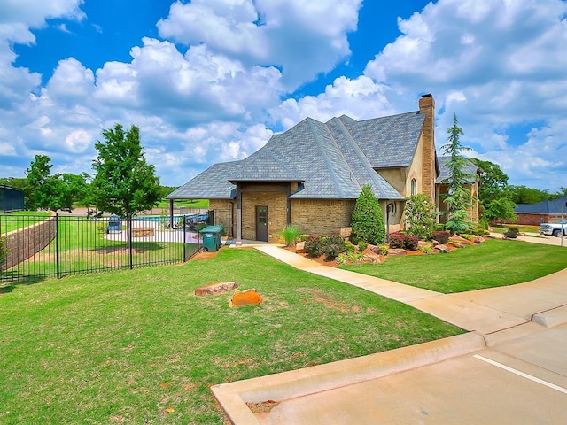 1109 Salvo Bridge Ct, Edmond, OK 73034 - view of front facade with brick siding and a chimney