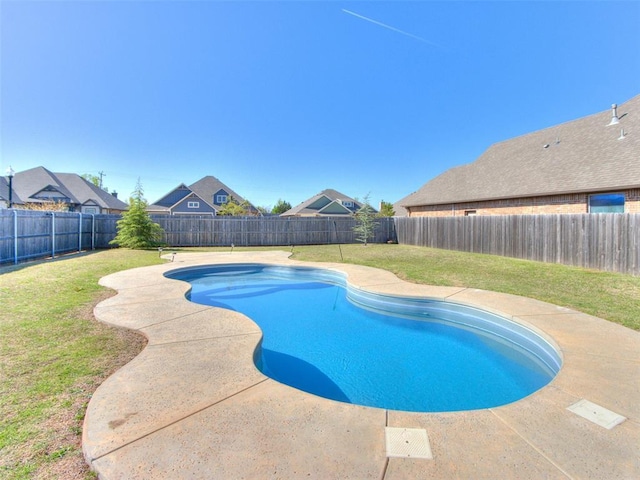 view of swimming pool featuring a patio area, a fenced backyard, a fenced in pool, and a lawn