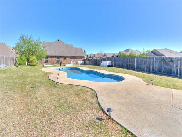 view of pool featuring a fenced in pool, a yard, a patio area, and a fenced backyard