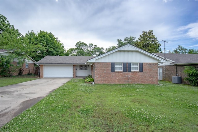 1527 N Pennsylvania Ave, Shawnee, OK 74804 - single story home featuring brick siding, a garage, driveway, and a front yard