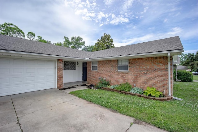 1527 N Pennsylvania Ave, Shawnee, OK 74804 - ranch-style home with brick siding, an attached garage, driveway, and roof with shingles