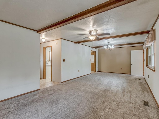 empty room with a textured ceiling, crown molding, baseboards, light carpet, and ceiling fan with notable chandelier
