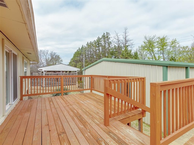 wooden deck featuring visible vents