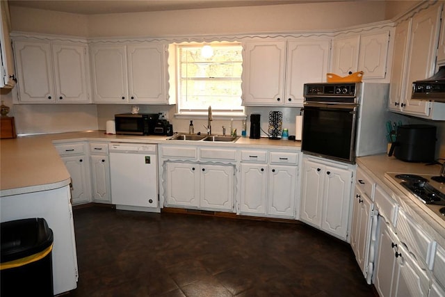 kitchen featuring a sink, white cabinets, and black appliances