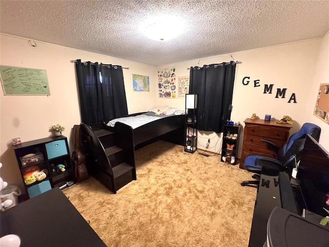 bedroom with light colored carpet and a textured ceiling