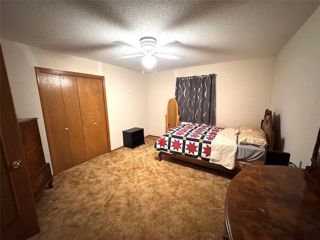 bedroom featuring carpet, a closet, ceiling fan, and a textured ceiling