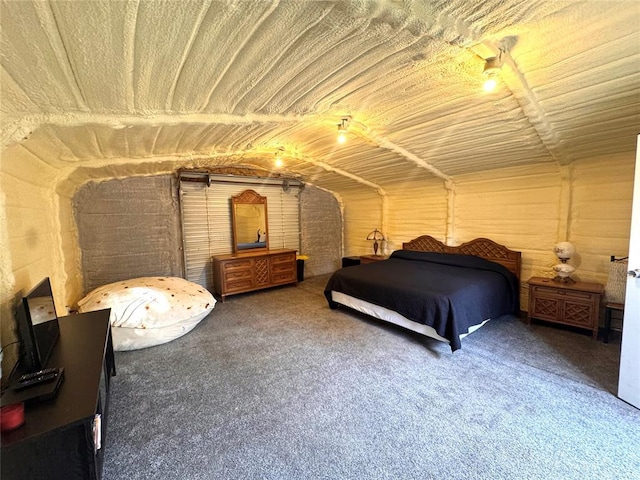 carpeted bedroom featuring vaulted ceiling