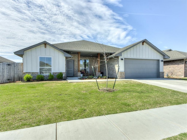 8512 NW 77th St, Oklahoma City, OK 73132 - ranch-style house featuring board and batten siding, a front yard, an attached garage, and concrete driveway