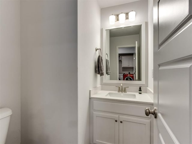 8512 NW 77th St, Oklahoma City, OK 73132 - half bathroom with washer / clothes dryer, toilet, and vanity