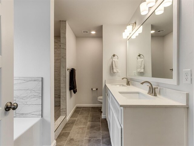 8512 NW 77th St, Oklahoma City, OK 73132 - bathroom featuring a sink, visible vents, toilet, and double vanity