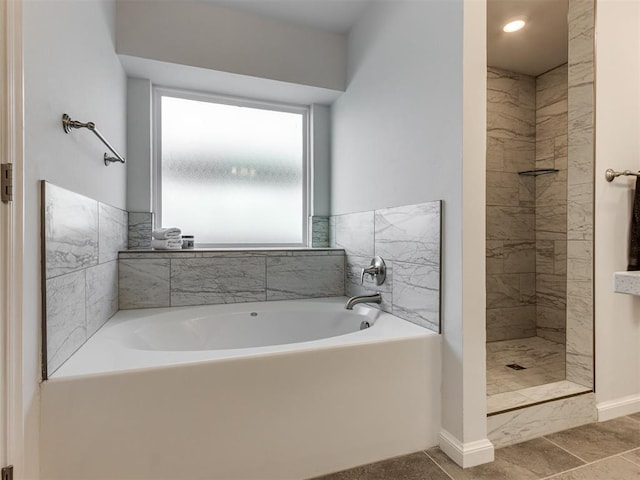 8512 NW 77th St, Oklahoma City, OK 73132 - full bath featuring a tile shower, baseboards, and a garden tub