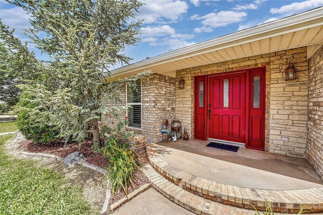 13989 US Highway 183, Hobart, OK 73651 - doorway to property featuring brick siding and covered porch