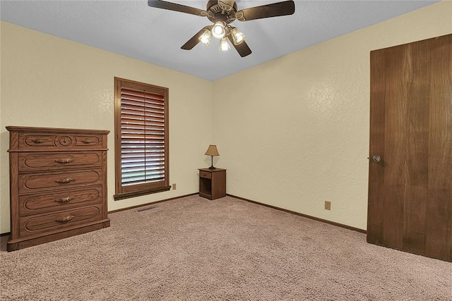 13989 US Highway 183, Hobart, OK 73651 - carpeted bedroom with a textured wall, ceiling fan, and baseboards