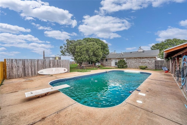 13989 US Highway 183, Hobart, OK 73651 - view of pool with a patio area, a fenced backyard, and a diving board