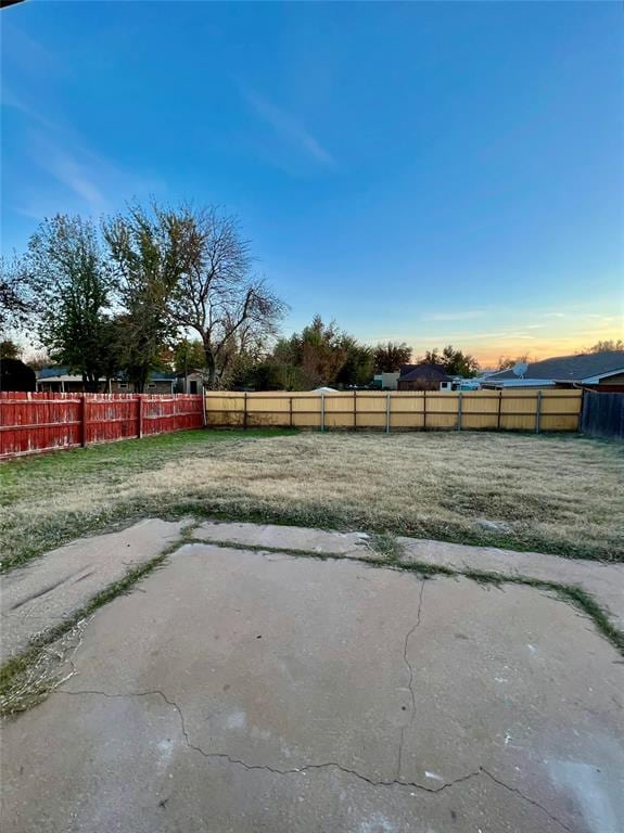 7440 NW 5th Ter, Oklahoma City, OK 73127 - yard at dusk with fence