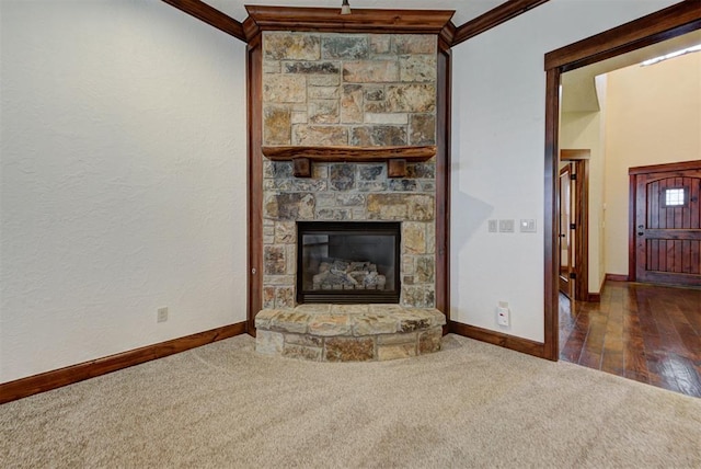 unfurnished living room with baseboards, carpet floors, and ornamental molding