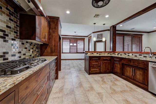 kitchen with ornamental molding, stainless steel appliances, a sink, light stone counters, and visible vents
