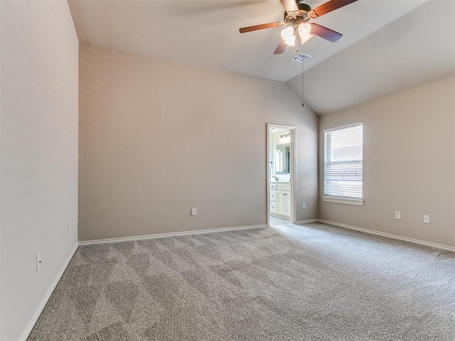 unfurnished room featuring visible vents, carpet, baseboards, ceiling fan, and lofted ceiling