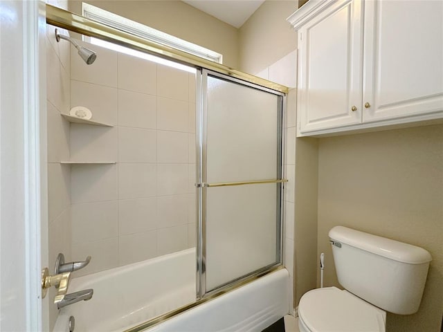 4000 Harrogate Dr, Norman, OK 73072 - bathroom featuring toilet and shower / bath combination with glass door