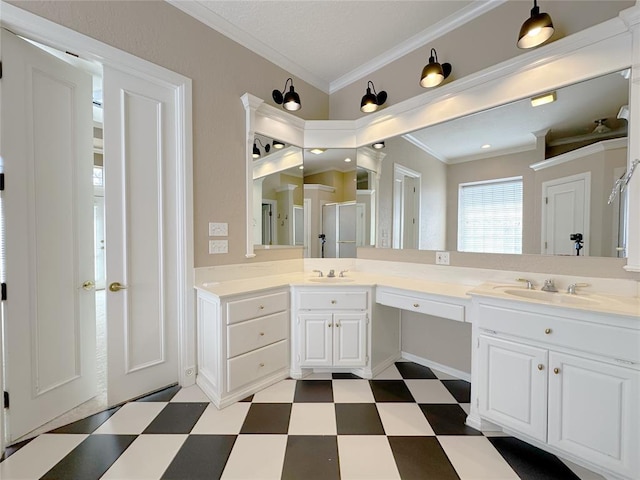 4000 Harrogate Dr, Norman, OK 73072 - bathroom featuring tile patterned floors, crown molding, double vanity, and a sink