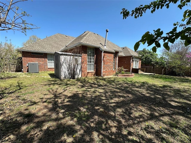 4000 Harrogate Dr, Norman, OK 73072 - rear view of house featuring a lawn, brick siding, and fence