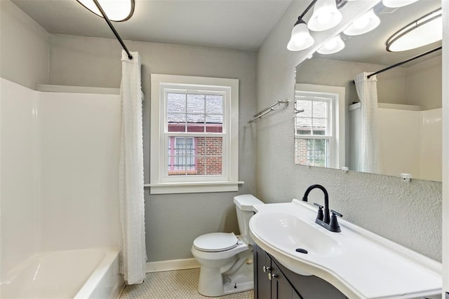 923 NE 19th St, Oklahoma City, OK 73105 - bathroom featuring vanity, toilet, healthy amount of natural light, and shower / tub combo