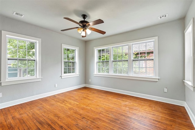 923 NE 19th St, Oklahoma City, OK 73105 - spare room with healthy amount of natural light, hardwood / wood-style flooring, and baseboards