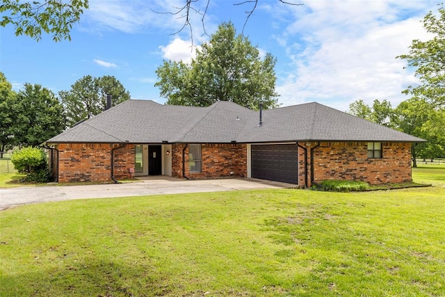 57 Serenada Ln, Shawnee, OK 74804 - view of front facade with a garage, concrete driveway, a front yard, and brick siding