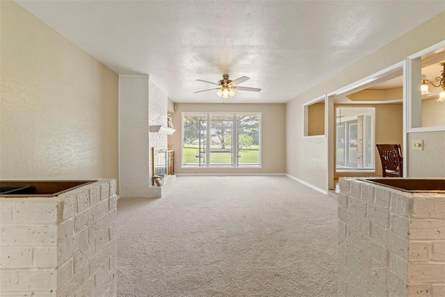 57 Serenada Ln, Shawnee, OK 74804 - unfurnished living room featuring a fireplace, carpet, a ceiling fan, and baseboards