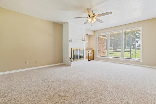 57 Serenada Ln, Shawnee, OK 74804 - unfurnished living room featuring ceiling fan, baseboards, carpet floors, and a brick fireplace