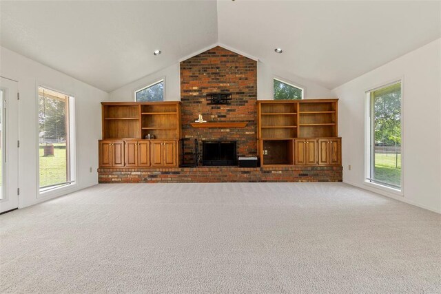 57 Serenada Ln, Shawnee, OK 74804 - unfurnished living room with lofted ceiling, carpet flooring, and a brick fireplace