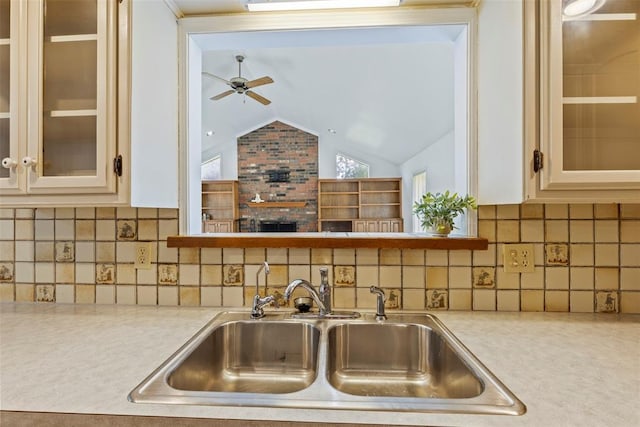 57 Serenada Ln, Shawnee, OK 74804 - kitchen featuring a sink, light countertops, lofted ceiling, a ceiling fan, and glass insert cabinets
