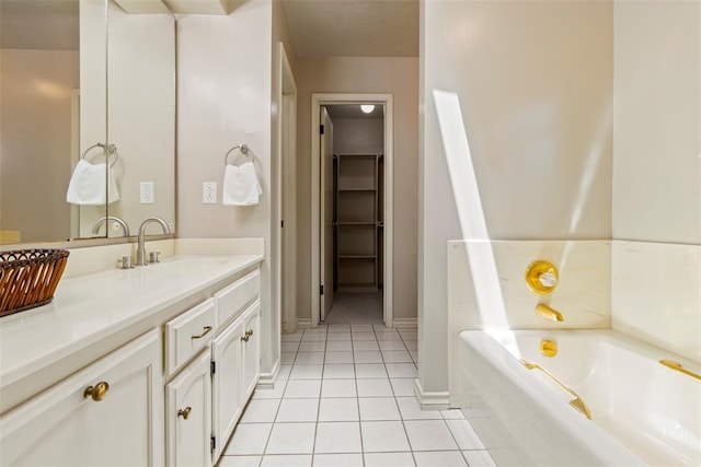 57 Serenada Ln, Shawnee, OK 74804 - bathroom featuring tile patterned floors, vanity, a garden tub, and baseboards