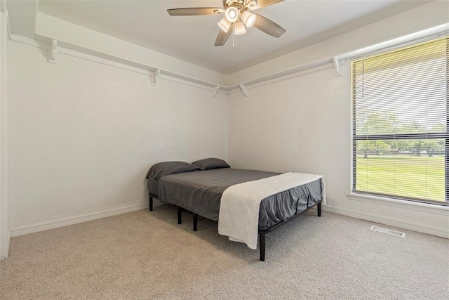 57 Serenada Ln, Shawnee, OK 74804 - carpeted bedroom with baseboards and a ceiling fan